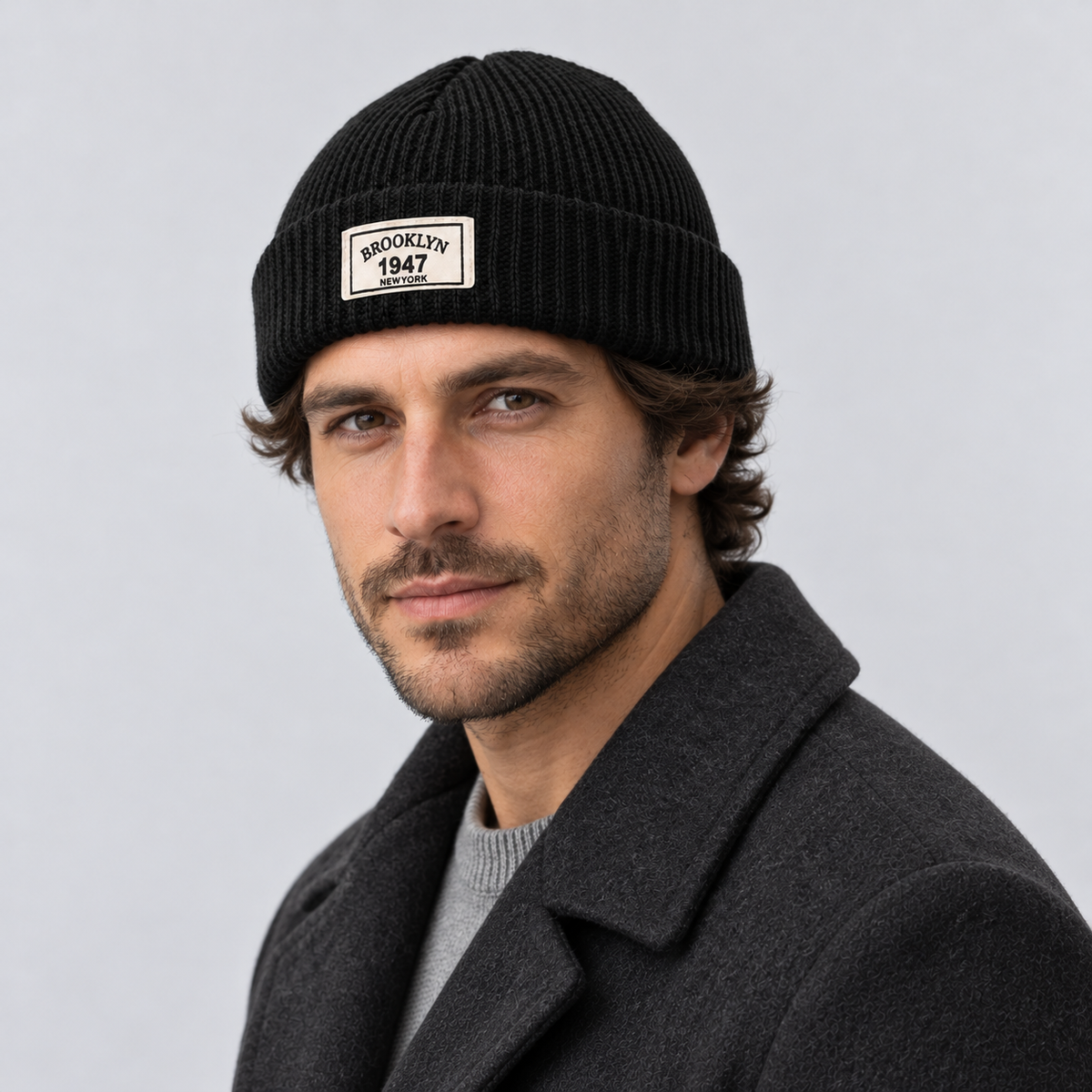 Rowenfield Men’s Hat Beanie Short Fisherman Cuffed Knit — Black — angled view worn by model