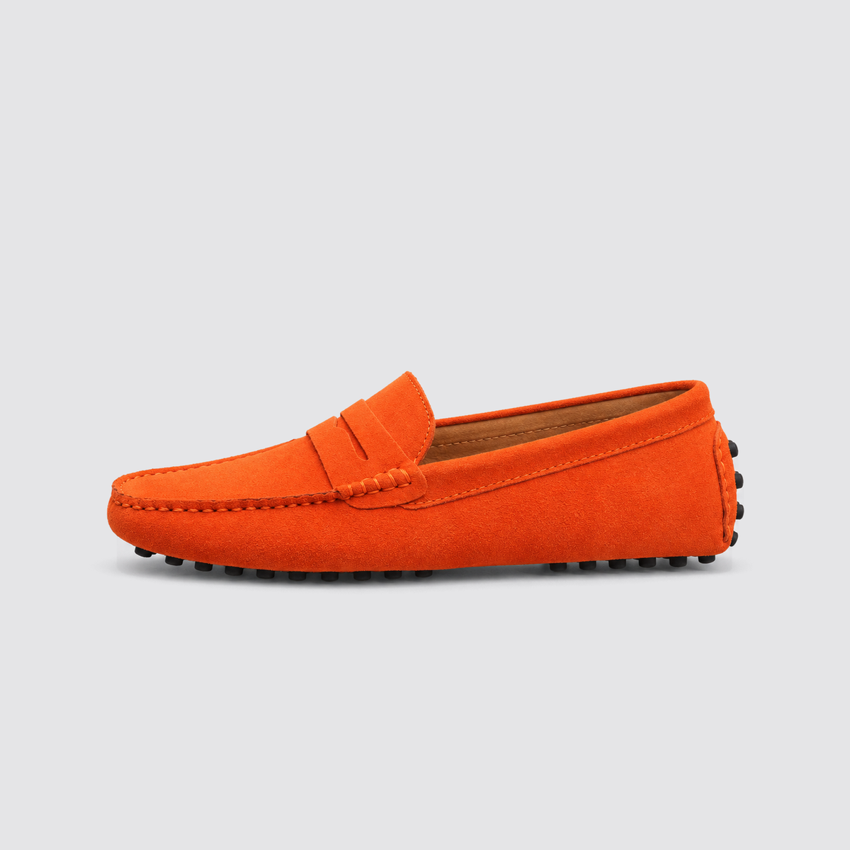 Orange loafer, side view, background #e5e5e7