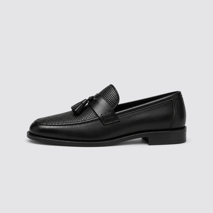 Black woven tassel loafer side profile