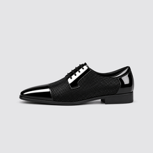 Black patent dress shoe side profile